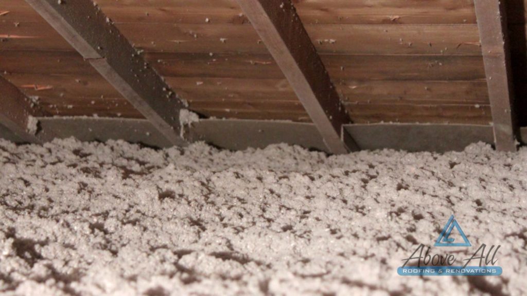 Completed R-50 cellulose insulation with cardboard air-flow chutes installed at eaves edges.