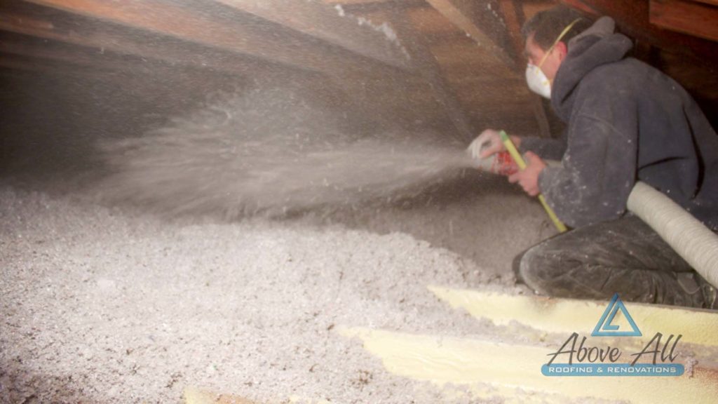 Cellulose Insulation being blown into attic to R-50.