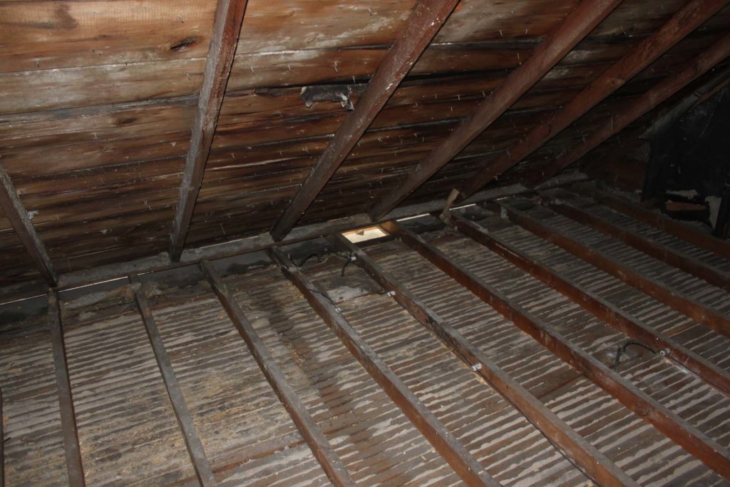 Attic insulation removed for 2" polyrethane spray foam vapour seal