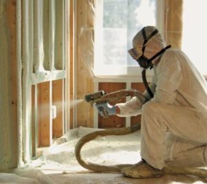 Spraying foam insulation in Winnipeg home.