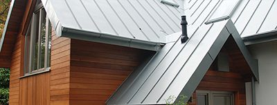 House with metal roof and wood siding.