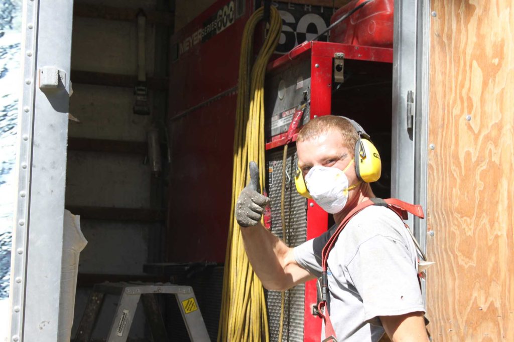 Worker giving the thumbs up.