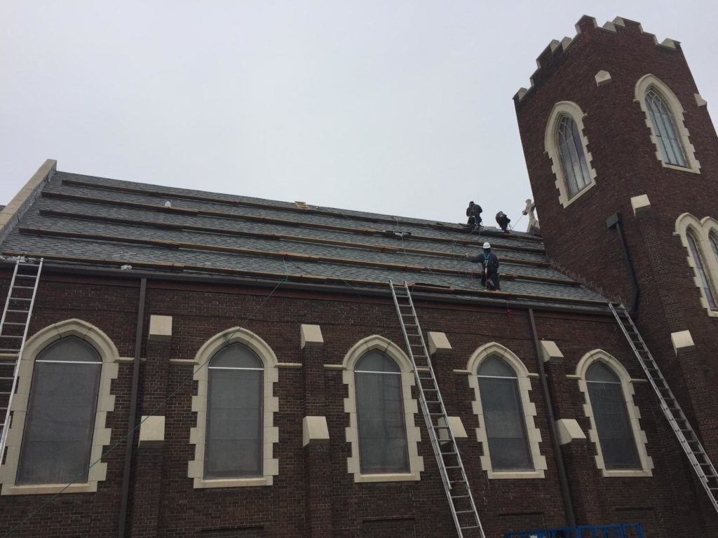 Our crew installing IKO Cambridge shingles on a church in the West End.