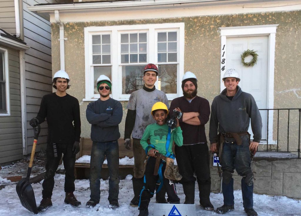 Crew photo in front of completed home.