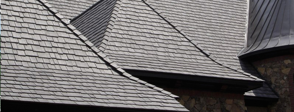 Grey composite slate roof on a house.